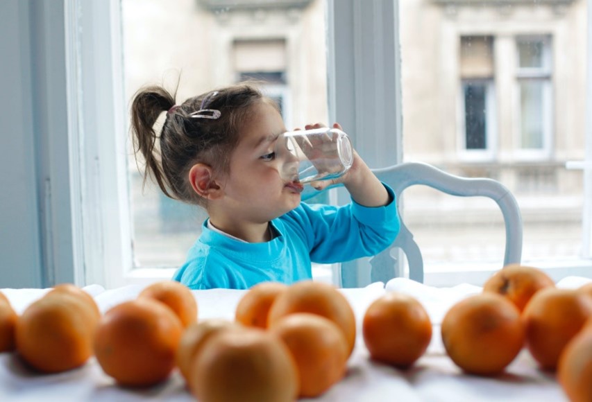 picture of a little girl drinking water