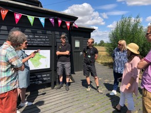 picture of Walker and Historic England members gathered in Wicken fen park