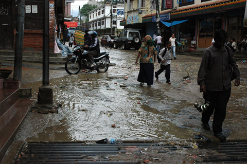 Picture of raining runoff in the muddy streets of Nepal