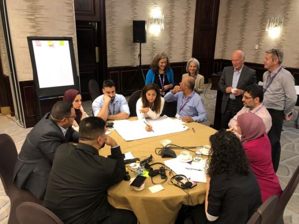 Participants in a round-table discussion during the workshop